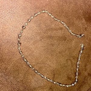 I don’t know the size of it, but it’s a all silver PD necklace.